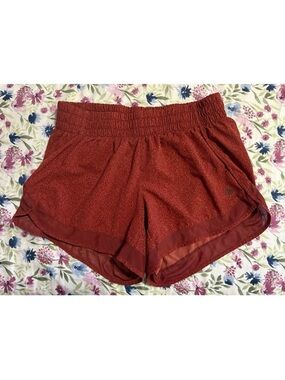 Athleta mesh racer run short 4” russet static orange